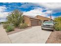 Attractive home featuring desert landscaping and a spacious driveway at 980 W Prior Ave, Coolidge, AZ 85128