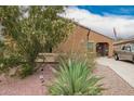 Charming home with desert landscaping and a welcoming entrance at 980 W Prior Ave, Coolidge, AZ 85128