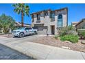 Exterior of home with desert landscaping, a spacious driveway, and an attached two-car garage at 9934 E Empress Ave, Mesa, AZ 85208