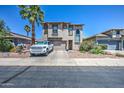 Exterior of home with desert landscaping, a spacious driveway, and an attached two-car garage at 9934 E Empress Ave, Mesa, AZ 85208