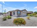 Attractive single-story home with desert landscaping and a neutral color palette at 11159 E Sebring Ave, Mesa, AZ 85212