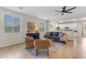 Inviting living room with neutral tones, tile flooring, and lots of natural light at 11159 E Sebring Ave, Mesa, AZ 85212