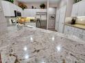 Close up of countertop features a beautiful granite countertop at 15539 W La Salinas Ln, Surprise, AZ 85374