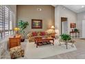 Comfortable living room features bright walls, stylish furniture and ample light at 15539 W La Salinas Ln, Surprise, AZ 85374