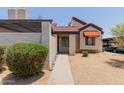 Quaint home with a covered parking area, mature landscaping, and a neutral color palette at 2144 E Center Ln # 3, Tempe, AZ 85281