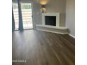 Bright living room with a decorative fireplace and sliding glass door at 2144 E Center Ln # 3, Tempe, AZ 85281