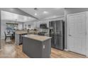 Modern kitchen features stainless steel appliances, granite countertops, and an island at 3373 W Five Mile Peak Dr, San Tan Valley, AZ 85144