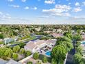 Stunning aerial view of the estate showcasing the pool, manicured grounds, and overall neighborhood at 4040 E Mclellan Rd # 16, Mesa, AZ 85205