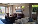 Comfortable dining area adjacent to the living room, perfect for Gathering meals and entertaining at 41318 N Belfair Way, Anthem, AZ 85086