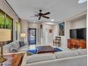 Comfortable living room with modern furniture and natural light from a skylight at 41318 N Belfair Way, Anthem, AZ 85086
