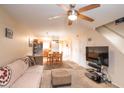Cozy living room with a ceiling fan, carpet, and comfortable seating at 455 S Mesa Dr # 104, Mesa, AZ 85210