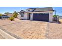 Charming home with a well-maintained yard, attractive landscaping, and a two car garage at 461 W Lindbergh Ave, Coolidge, AZ 85128