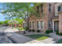 Attractive home boasts stone facade, arched windows, trimmed shrubs, and verdant landscaping at 4777 S Fulton Ranch Blvd # 2071, Chandler, AZ 85248