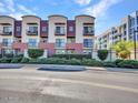 Modern three-story townhouse with private balconies and manicured landscaping at 525 W Lakeside Dr # 151, Tempe, AZ 85281