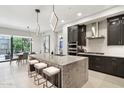 Open kitchen with a large island and modern pendant lighting, perfect for entertaining at 5250 E Deer Valley Dr # 247, Phoenix, AZ 85054