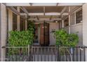 Charming front porch with well-manicured greenery and seating at 5420 N Granite Reef Rd, Scottsdale, AZ 85250