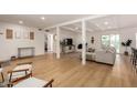 Bright and spacious living room with wood floors, fireplace, and an open floor plan at 6835 E Friess Dr, Scottsdale, AZ 85254