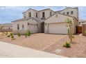 Gorgeous two-story home with charming architectural details and a spacious brick driveway at 8817 W Denton Ln, Glendale, AZ 85305