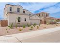 A beautiful home with a brick driveway and desert landscaping for low maintenance at 8817 W Denton Ln, Glendale, AZ 85305