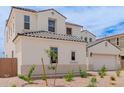 Lovely home featuring neutral colors, a two-car garage, and desert landscaping at 8817 W Denton Ln, Glendale, AZ 85305
