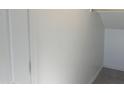 Clean, neutral closet with white walls and trim, and light-colored tile flooring at 18001 W Lupine Ave, Goodyear, AZ 85338