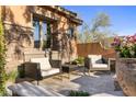 Inviting patio with comfortable seating and desert flora at 18127 N 98Th Way, Scottsdale, AZ 85255