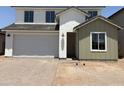New two-story home featuring a two-car garage with a xeriscaped front yard at 18162 W Larkspur Dr, Goodyear, AZ 85338
