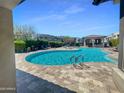 Inviting community pool area with lounge chairs and cabana, perfect for relaxation and socializing at 23386 N 73Rd Way, Scottsdale, AZ 85255
