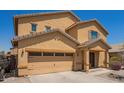Charming home with a two-car garage, covered porch, and desert landscaping for easy maintenance at 25218 W Carson Ct, Buckeye, AZ 85326