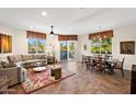 Bright living room featuring tile floors, neutral decor, and large windows with outdoor views at 3801 N Goldwater Blvd # 201, Scottsdale, AZ 85251