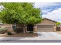Charming single-Gathering home with a desert landscape and a spacious two car driveway at 4216 W Harwell Rd, Laveen, AZ 85339
