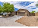 Charming single-Gathering home with a desert landscape and a spacious two car driveway at 4216 W Harwell Rd, Laveen, AZ 85339