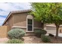 Charming single-Gathering home with a desert landscape and a side view at 4216 W Harwell Rd, Laveen, AZ 85339