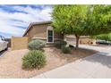 Charming single-Gathering home with a desert landscape and a sidewalk in front at 4216 W Harwell Rd, Laveen, AZ 85339