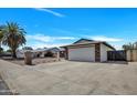 View of house showcasing a two-car garage, low maintenance landscaping, and a desert climate at 4720 W Northview Ave, Glendale, AZ 85301