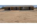 New construction home featuring the framing stages and new windows, waiting for customization at 5055 N Jayson Rd, Casa Grande, AZ 85194