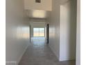 Inviting home entryway with neutral tile floors, clean white walls, and ample natural light at 9429 W Sandstone Mountain Dr, Casa Grande, AZ 85194