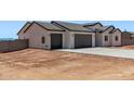 Charming single-story home featuring a spacious three-car garage and a low-maintenance desert landscape at 9429 W Sandstone Mountain Dr, Casa Grande, AZ 85194