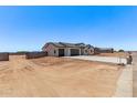 Charming single-story home featuring a spacious three-car garage and a low-maintenance desert landscape at 9429 W Sandstone Mountain Dr, Casa Grande, AZ 85194