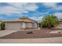 Charming single-story home boasts a two-car garage, desert landscaping, and inviting curb appeal at 10722 W Irma Ln, Peoria, AZ 85373