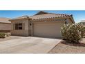Beautiful home featuring a tile roof, two-car garage, and desert landscaping at 11531 E Persimmon Ave, Mesa, AZ 85212