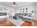 Inviting living room with a comfortable couch, stylish rug, and ample natural light at 1233 E El Camino Dr, Phoenix, AZ 85020