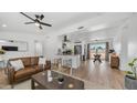 Inviting living space flows into a modern kitchen with a breakfast bar at 1717 W Roma Ave, Phoenix, AZ 85015