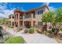 Charming two-story home with well-kept lawn, stone accents, and mature landscaping at 2821 S Skyline Dr # 157, Mesa, AZ 85212