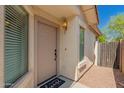 Charming front entrance featuring a welcoming door, stylish light fixture, and a cute welcome mat at 29161 N Lilly Ln, San Tan Valley, AZ 85143
