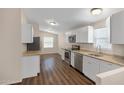 Well-lit kitchen with stainless steel appliances, granite countertops, and ample cabinet space at 320 E Mckellips Rd # 163, Mesa, AZ 85201