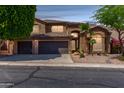 Charming two-story home featuring a three-car garage and desert landscaping at 408 E Silverwood Dr, Phoenix, AZ 85048