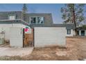 Well-maintained townhouse displaying a private gated entrance, with a brick wall and a peek at the upstairs windows at 8125 N 32Nd Dr, Phoenix, AZ 85051