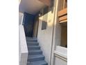 Home entrance featuring gray stairs, an entrance door, and the unit number at 818 S Westwood -- # 233, Mesa, AZ 85210