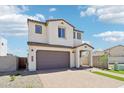 Lovely two-story home featuring a garage and a brick paved driveway with a manicured front yard at 10241 E Ursula Ave, Mesa, AZ 85212
